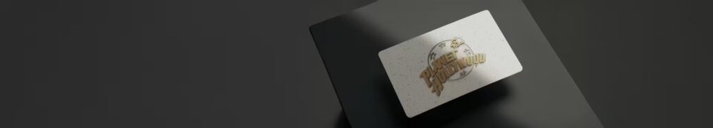 A Planet Hollywood gift card on a gray tablecloth