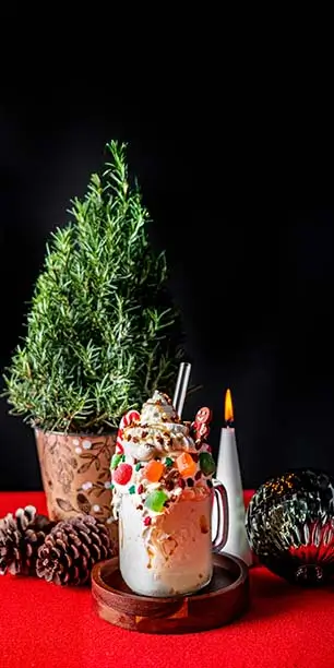 A Gingerbread Smash milkshake on a cozy table