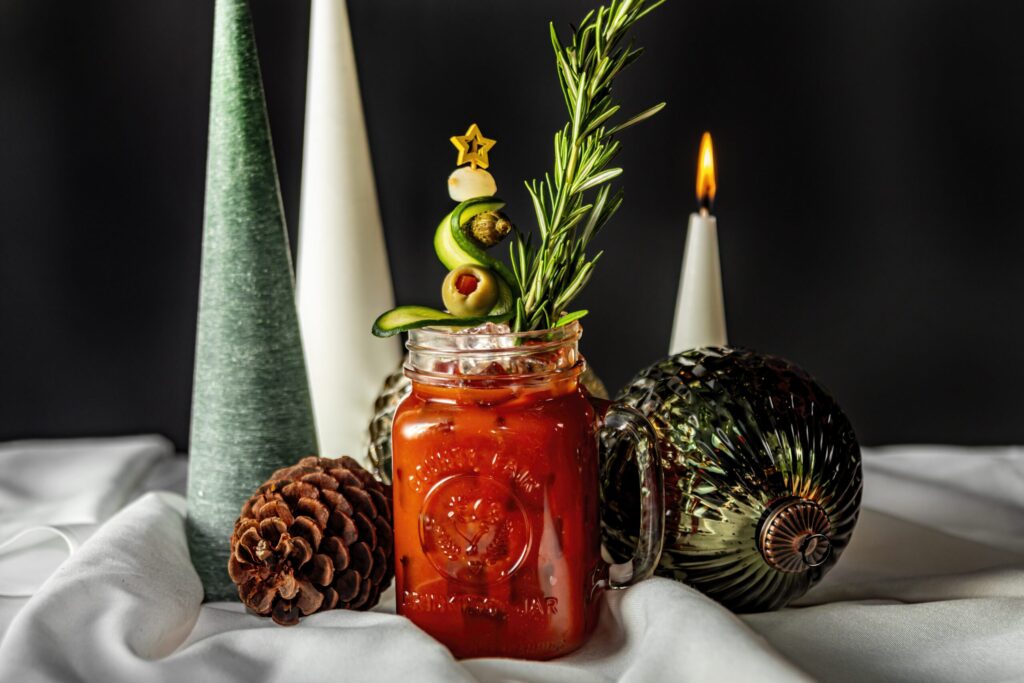 The "Bloody Merry" signature holiday cocktail at Planet Hollywood NYC, garnished with rosemary.