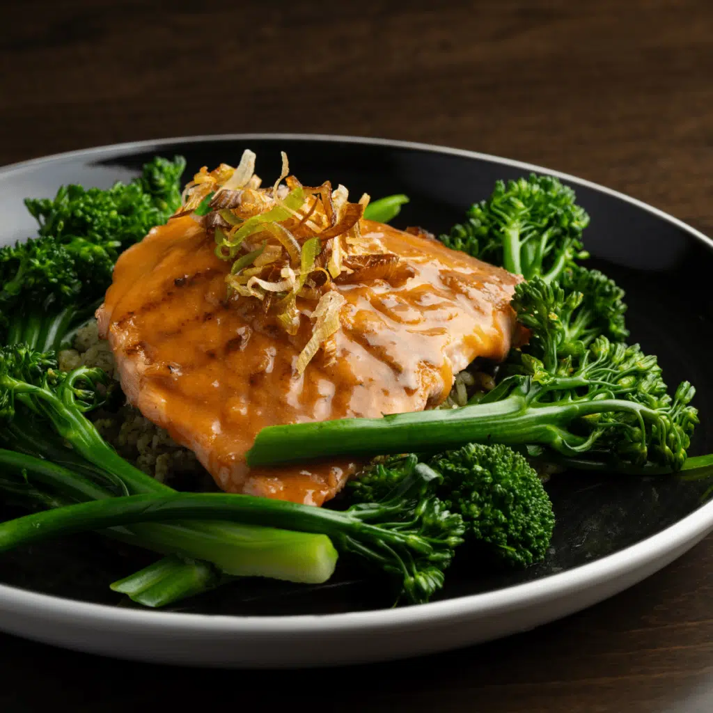A grilled salmon filet with a soy ginger sesame glaze