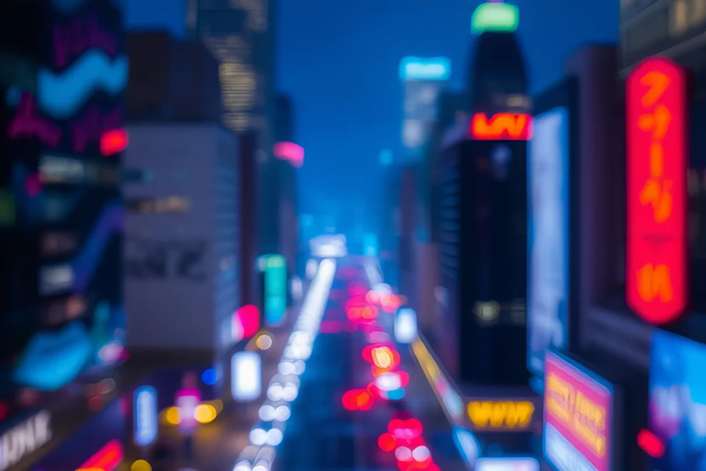 Blurred nighttime view of Times Square in New York City with colorful neon lights, traffic, and illuminated billboards creating a vibrant urban scene.
