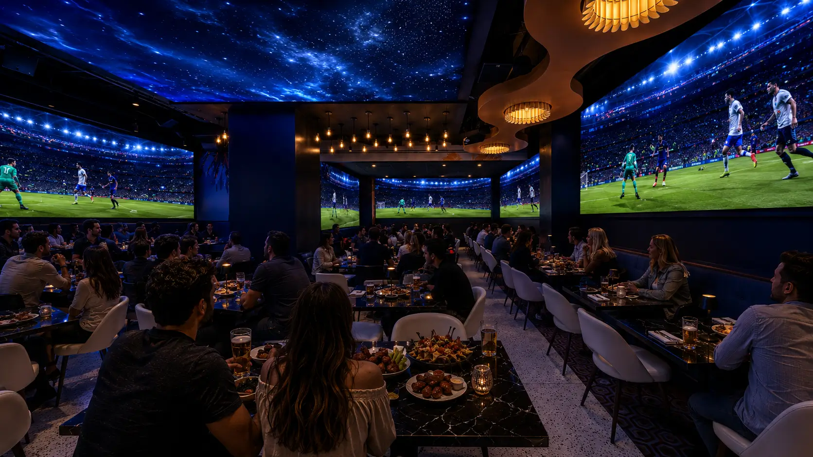 Guests watch soccer on massive screens inside Planet Hollywood NYC.