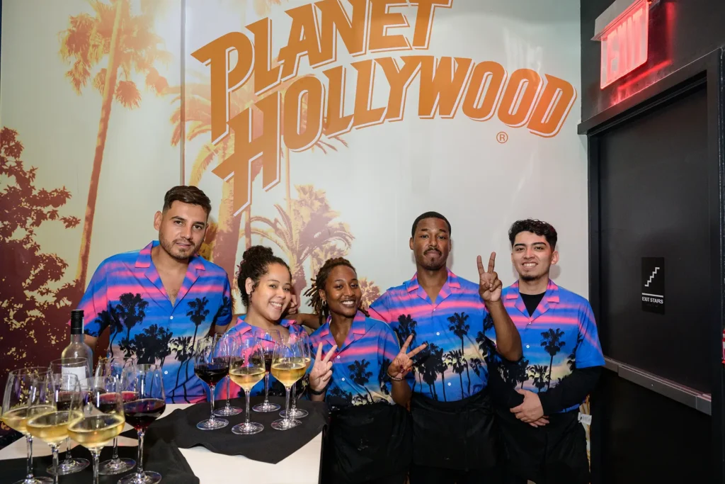Planet Hollywood NYC team members posing together during a private event
