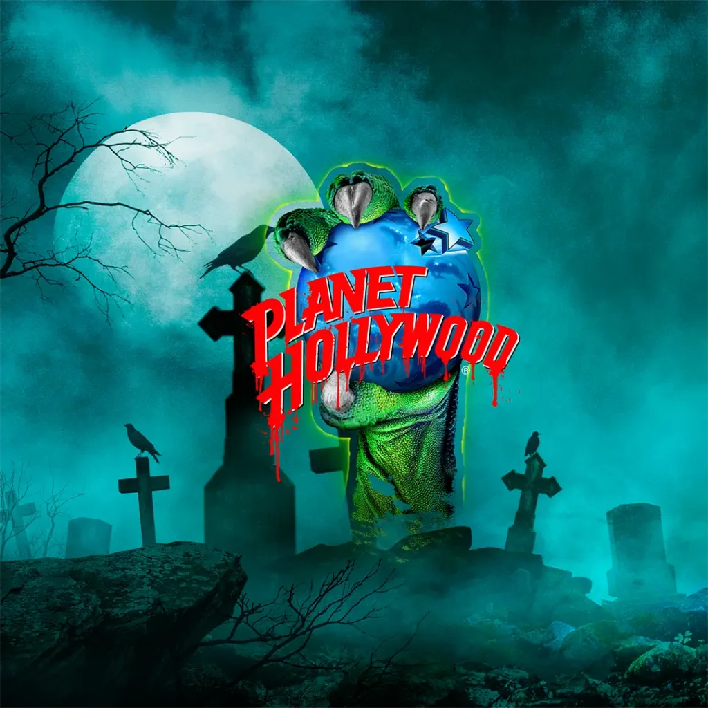 Planet Hollywood Halloween logo emerging from a foggy graveyard beneath a full moon.